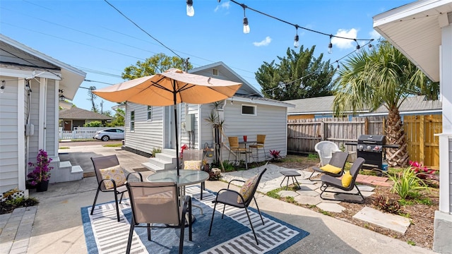 1615 28th Ave N, Saint Petersburg, FL 33713 - view of patio / terrace featuring area for grilling, outdoor dining area, and entry steps