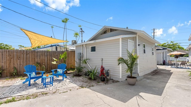 1615 28th Ave N, Saint Petersburg, FL 33713 - view of side of property featuring a patio area and outdoor dining area