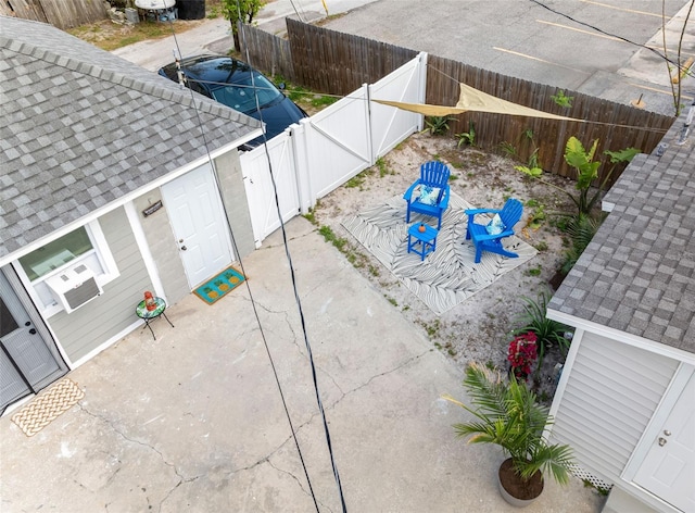 1615 28th Ave N, Saint Petersburg, FL 33713 - fenced backyard with a patio and a gate