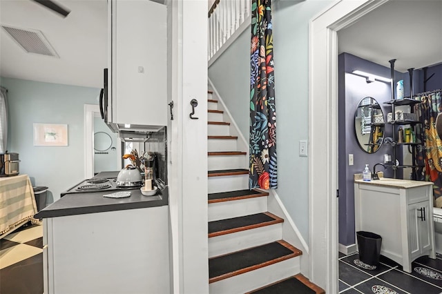 634 6th St N, Saint Petersburg, FL 33701 - stairs with tile patterned floors