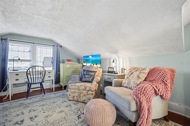 634 6th St N, Saint Petersburg, FL 33701 - sitting room featuring a textured ceiling, vaulted ceiling, and wood finished floors