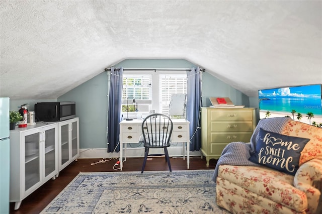 634 6th St N, Saint Petersburg, FL 33701 - office space featuring a textured ceiling, wood finished floors, lofted ceiling, and baseboards