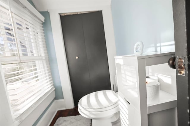 634 6th St N, Saint Petersburg, FL 33701 - bathroom featuring toilet and wood finished floors