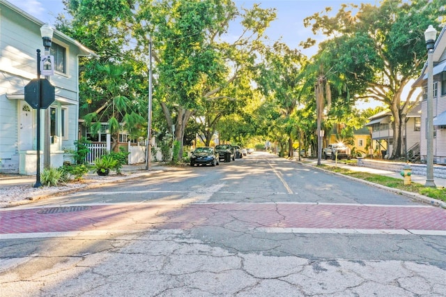 634 6th St N, Saint Petersburg, FL 33701 - view of asphalt road featuring street lighting, curbs, sidewalks, and a residential view