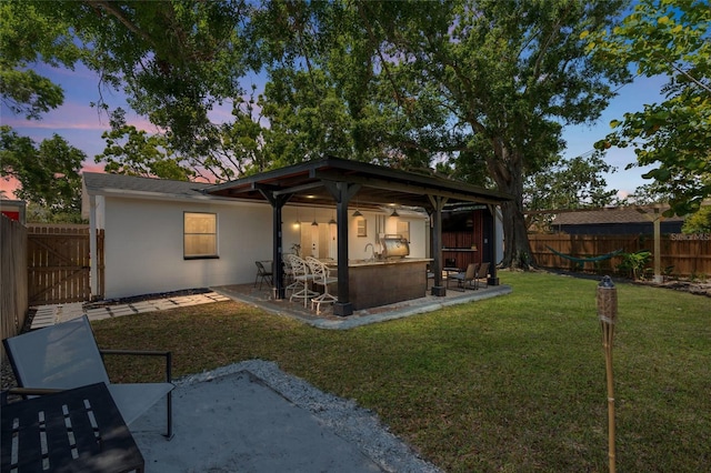 1851 Oklahoma Ave NE, Saint Petersburg, FL 33703 - back of property with a patio and stucco siding
