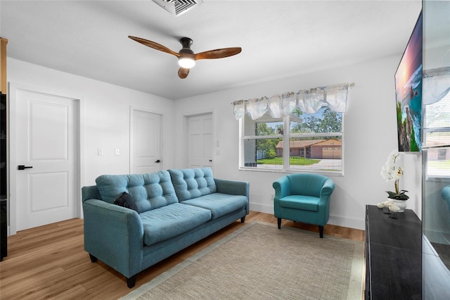 1851 Oklahoma Ave NE, Saint Petersburg, FL 33703 - living area with a ceiling fan and light wood-type flooring
