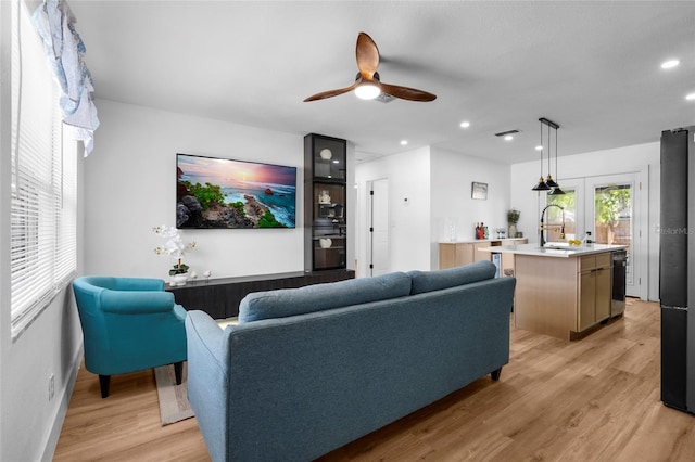 1851 Oklahoma Ave NE, Saint Petersburg, FL 33703 - living area featuring light wood-type flooring, a ceiling fan, recessed lighting, and baseboards