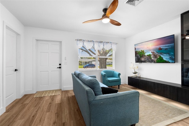1851 Oklahoma Ave NE, Saint Petersburg, FL 33703 - living room featuring wood finished floors, ceiling fan, and baseboards