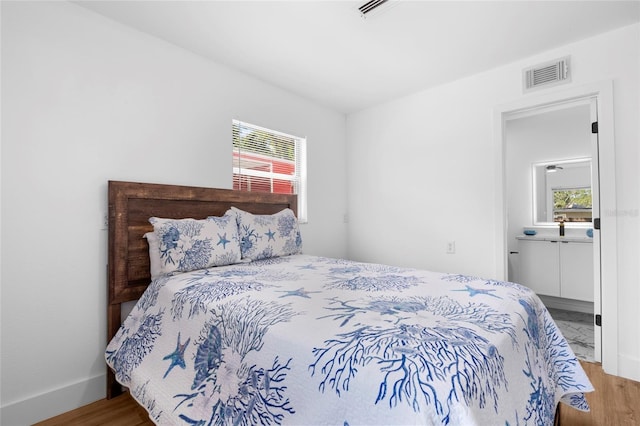 1851 Oklahoma Ave NE, Saint Petersburg, FL 33703 - bedroom with wood finished floors and baseboards