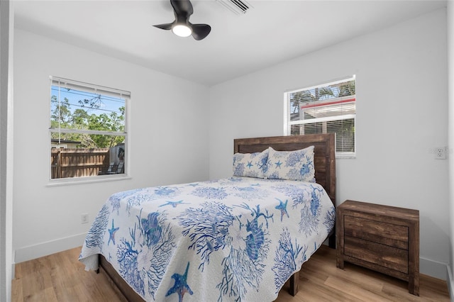 1851 Oklahoma Ave NE, Saint Petersburg, FL 33703 - bedroom featuring wood finished floors, baseboards, and a ceiling fan