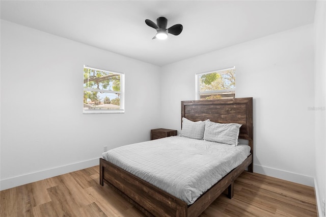1851 Oklahoma Ave NE, Saint Petersburg, FL 33703 - bedroom featuring baseboards, light wood finished floors, and a ceiling fan
