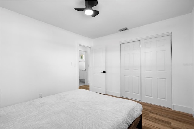 1851 Oklahoma Ave NE, Saint Petersburg, FL 33703 - bedroom with wood finished floors, a closet, baseboards, and a ceiling fan