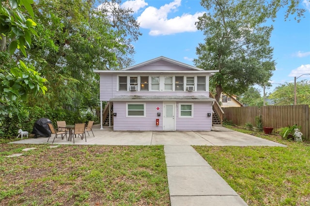 1115 Highland St N, Saint Petersburg, FL 33701 - view of front of home with stairway and a patio area