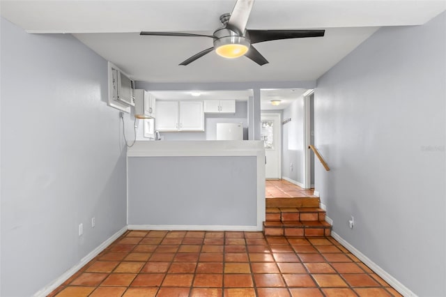1115 Highland St N, Saint Petersburg, FL 33701 - unfurnished living room featuring ceiling fan, light tile patterned floors, and baseboards