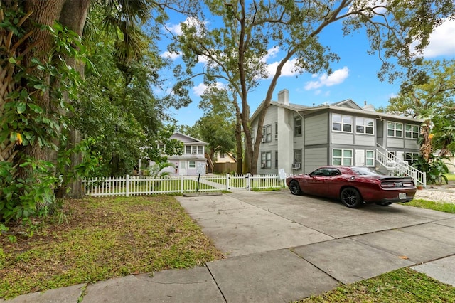 1115 Highland St N, Saint Petersburg, FL 33701 - view of front facade with a chimney