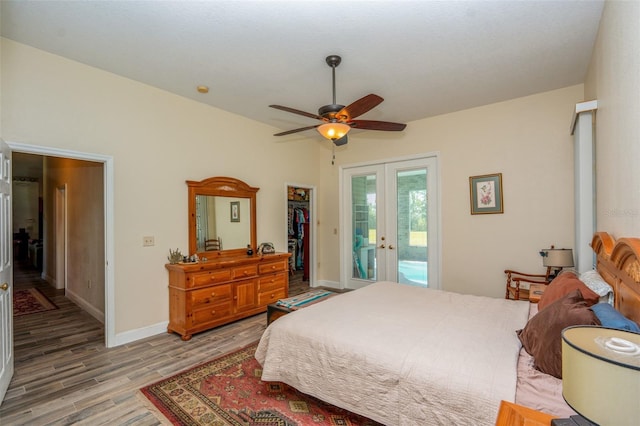 14365 Evans Ranch Rd, Lakeland, FL 33809 - bedroom featuring french doors, access to outside, light wood-type flooring, baseboards, and a ceiling fan