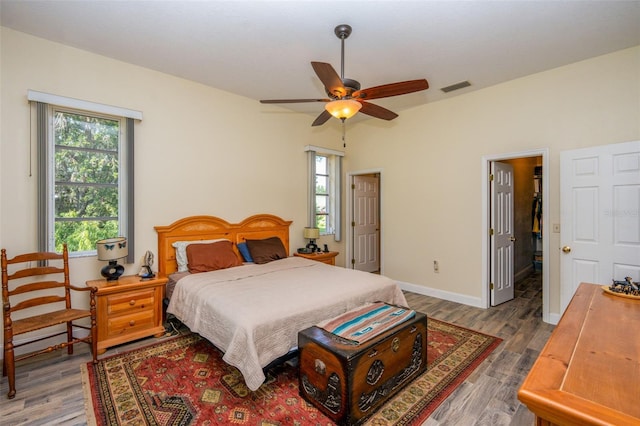 14365 Evans Ranch Rd, Lakeland, FL 33809 - bedroom with wood finished floors, multiple windows, and baseboards