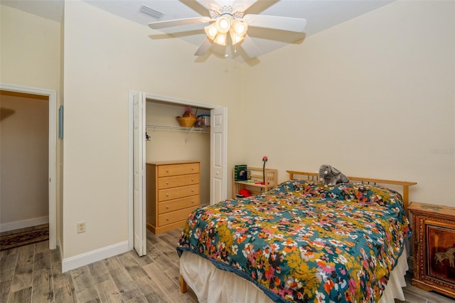 14365 Evans Ranch Rd, Lakeland, FL 33809 - bedroom with light wood-style floors, a closet, ceiling fan, and baseboards
