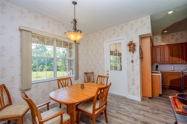 14365 Evans Ranch Rd, Lakeland, FL 33809 - dining space featuring light wood-style floors, wallpapered walls, baseboards, and recessed lighting