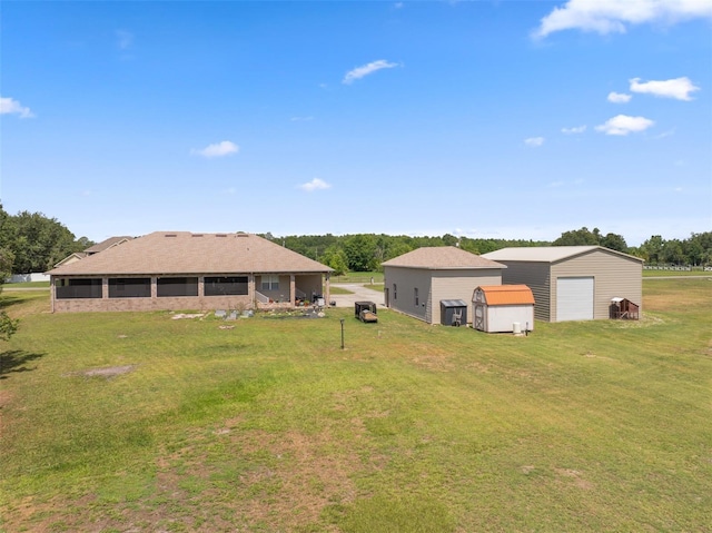 14365 Evans Ranch Rd, Lakeland, FL 33809 - view of green lawn with a detached garage