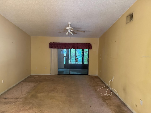 1371 Pine Ridge Cir E Unit B8, Tarpon Springs, FL 34688 - carpeted spare room with a ceiling fan, a textured ceiling, and baseboards