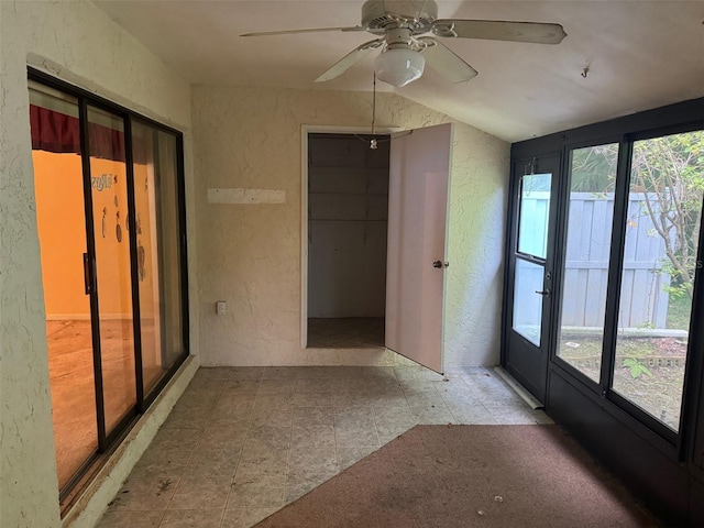 1371 Pine Ridge Cir E Unit B8, Tarpon Springs, FL 34688 - unfurnished sunroom with lofted ceiling
