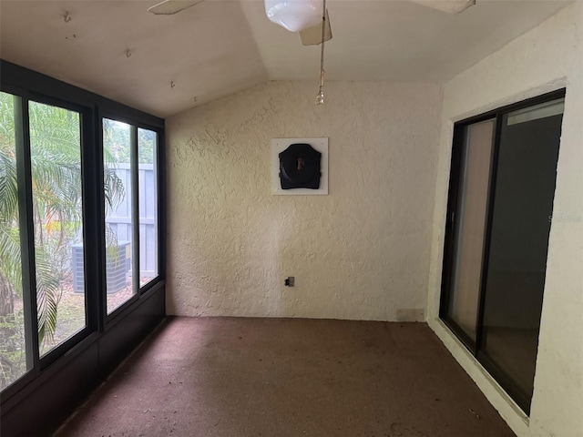 1371 Pine Ridge Cir E Unit B8, Tarpon Springs, FL 34688 - unfurnished sunroom featuring lofted ceiling
