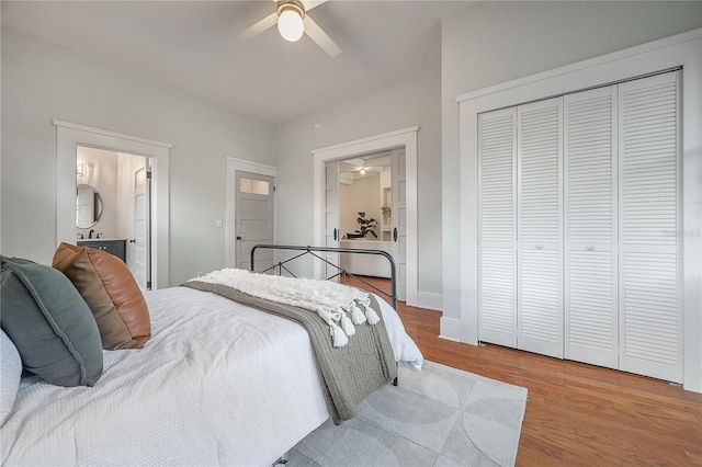 5301 N Central Ave, Tampa, FL 33603 - bedroom with wood finished floors, ensuite bath, a closet, a ceiling fan, and baseboards