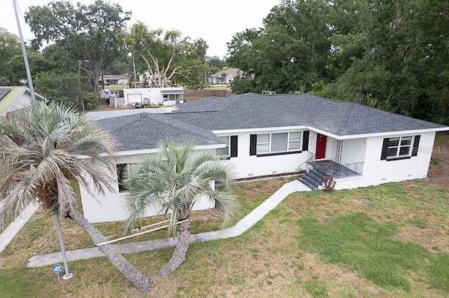 1816 W Lake Parker Dr, Lakeland, FL 33805 - single story home featuring roof with shingles and a front lawn