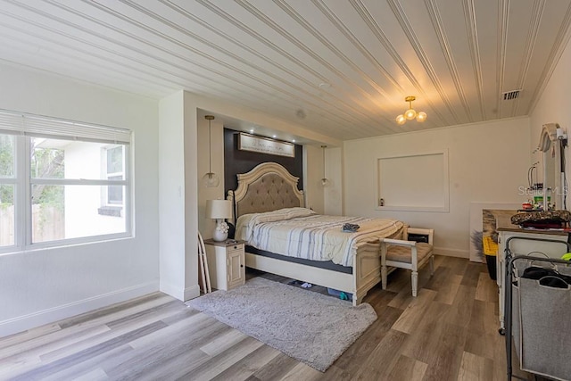 1816 W Lake Parker Dr, Lakeland, FL 33805 - bedroom featuring light wood finished floors, baseboards, and wooden ceiling