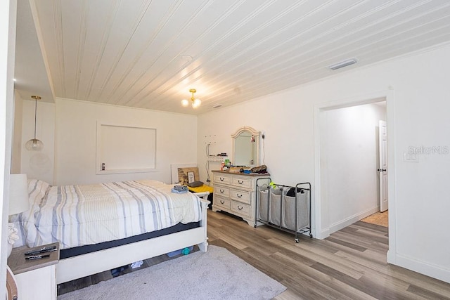 1816 W Lake Parker Dr, Lakeland, FL 33805 - bedroom with light wood-style flooring, wooden ceiling, and baseboards