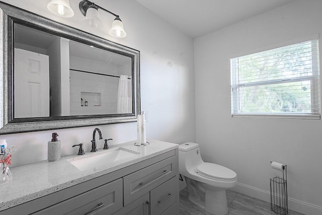 1816 W Lake Parker Dr, Lakeland, FL 33805 - bathroom featuring vanity, toilet, baseboards, and a shower with shower curtain