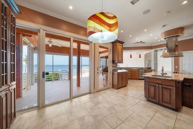 812 Point Seaside Dr, Crystal Beach, FL 34681 - kitchen featuring ornamental molding, a sink, a water view, pendant lighting, and light stone countertops