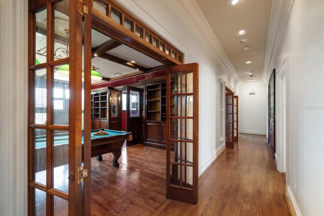 812 Point Seaside Dr, Crystal Beach, FL 34681 - hallway with french doors, ornamental molding, wood finished floors, baseboards, and recessed lighting