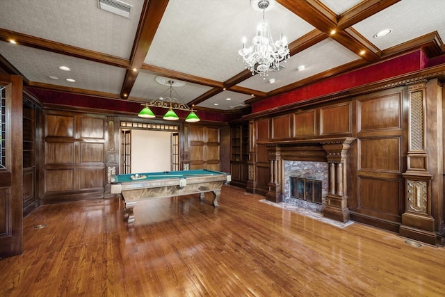 812 Point Seaside Dr, Crystal Beach, FL 34681 - playroom with coffered ceiling, wood finished floors, beamed ceiling, billiards, and a chandelier