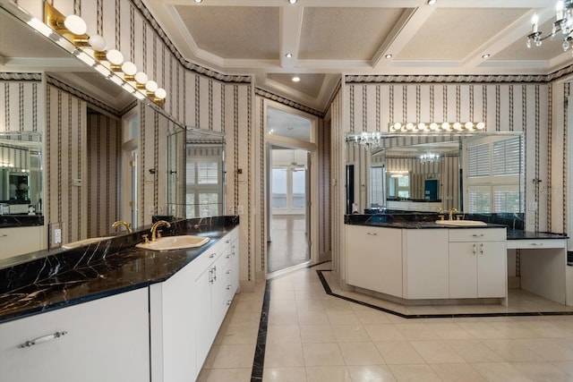 812 Point Seaside Dr, Crystal Beach, FL 34681 - full bath with wallpapered walls, inlaid floor details, two vanities, ornamental molding, and tile patterned flooring
