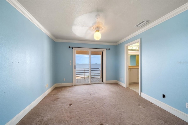 812 Point Seaside Dr, Crystal Beach, FL 34681 - unfurnished room with crown molding, carpet floors, baseboards, and a ceiling fan