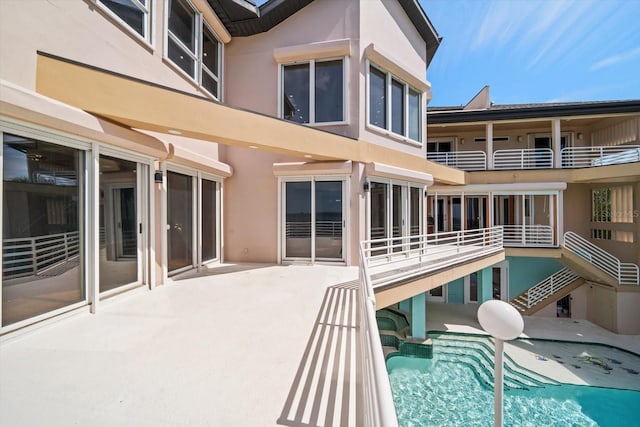 812 Point Seaside Dr, Crystal Beach, FL 34681 - view of swimming pool with a pool with connected hot tub and a patio