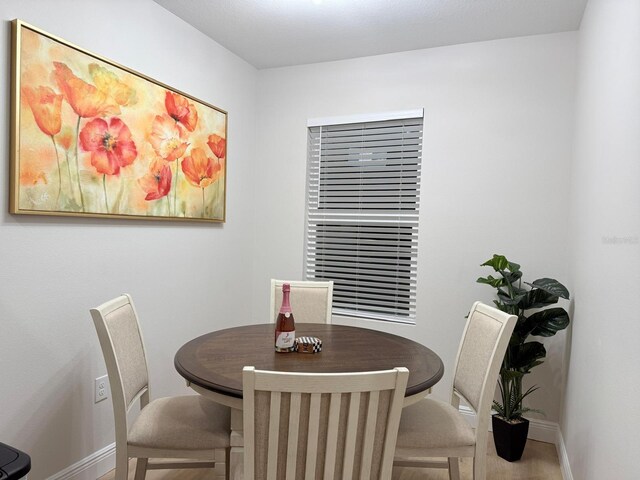 6977 Hawksbury St, Englewood, FL 34224 - dining space with baseboards