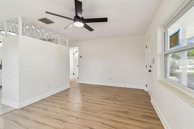 3818 Grove St S, Saint Petersburg, FL 33705 - unfurnished room featuring wood finished floors, ceiling fan, and baseboards