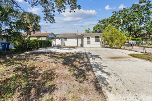3818 Grove St S, Saint Petersburg, FL 33705 - view of front facade with a gate and concrete driveway