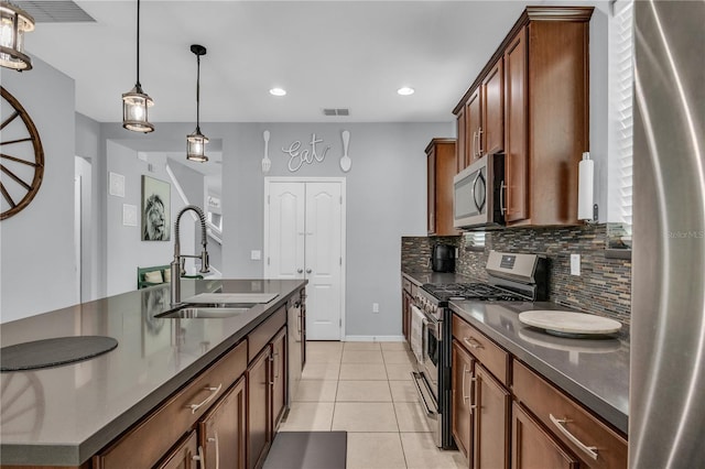 7238 Milestone Dr, Apollo Beach, FL 33572 - kitchen with appliances with stainless steel finishes, a sink, dark countertops, decorative backsplash, and light tile patterned flooring
