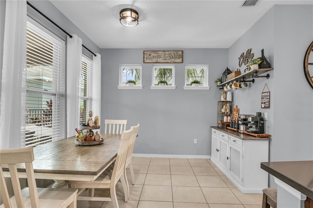 7238 Milestone Dr, Apollo Beach, FL 33572 - dining space featuring healthy amount of natural light, baseboards, and light tile patterned flooring