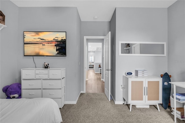 7238 Milestone Dr, Apollo Beach, FL 33572 - bedroom featuring baseboards and light colored carpet