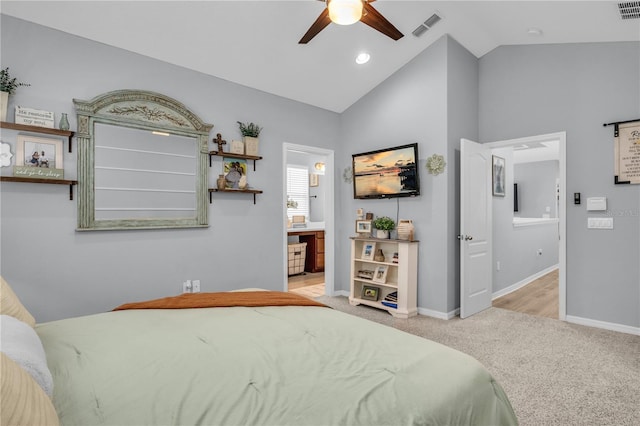 7238 Milestone Dr, Apollo Beach, FL 33572 - bedroom with baseboards, connected bathroom, carpet flooring, ceiling fan, and high vaulted ceiling