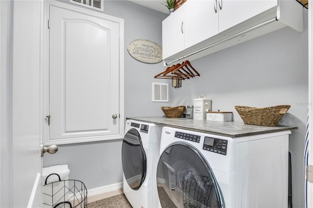 7238 Milestone Dr, Apollo Beach, FL 33572 - laundry room featuring washer and dryer, cabinet space, and baseboards