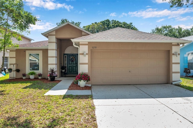 3230 Bellericay Ln, Land O Lakes, FL 34638 - ranch-style home with stucco siding, a garage, concrete driveway, roof with shingles, and a front yard