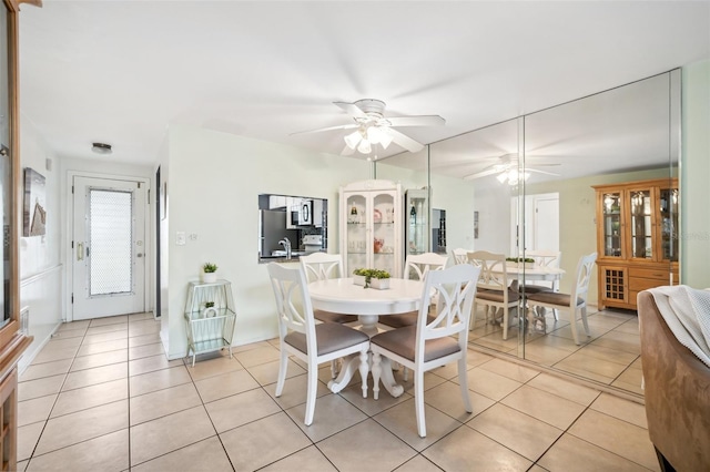 4229 Glissade Dr, New Port Richey, FL 34652 - dining area featuring light tile patterned flooring and a ceiling fan