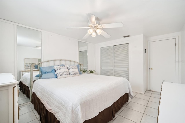 4229 Glissade Dr, New Port Richey, FL 34652 - bedroom with light tile patterned floors, a ceiling fan, and a closet