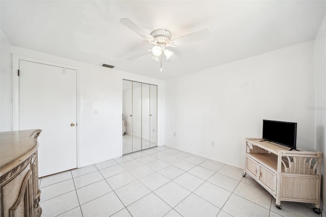 4229 Glissade Dr, New Port Richey, FL 34652 - living area with a ceiling fan and light tile patterned floors